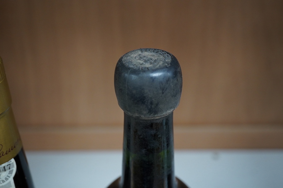 A bottle of Fonseca's vintage port 1963 and a bottle of Porto Ramos Pinto (10 years). Condition - storage unknown, appears good other than some wear